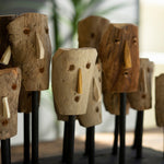 Carved Wooden Masks on a Wooden Base