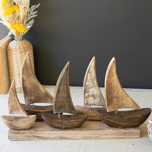 Five Wooden Sailboats on a Base Sculpture
