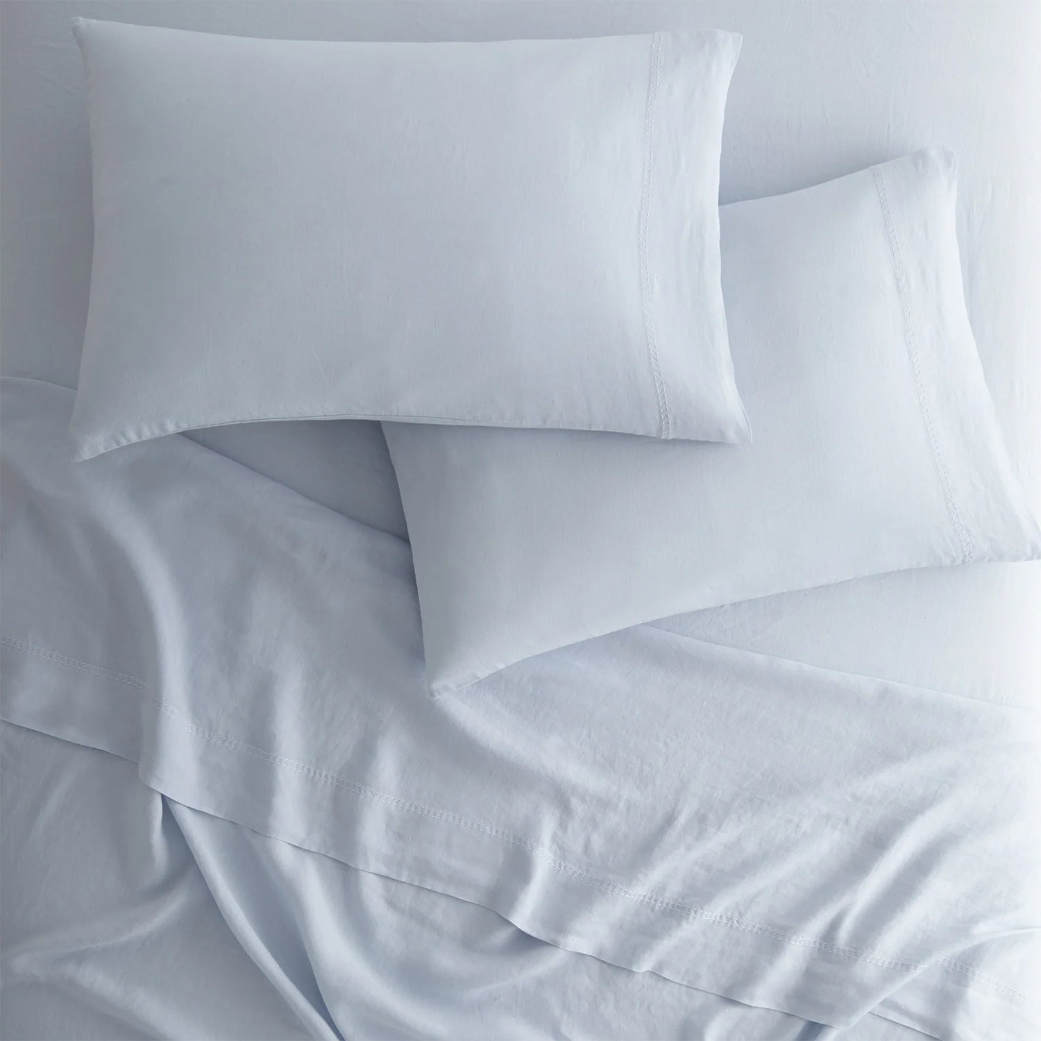 Peacock Alley European washed linen sheet set draped and layered detail