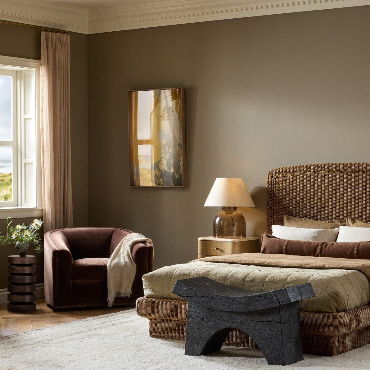 Four Hands Presley Monte Chocolate Swivel Chair shown in a decorated space