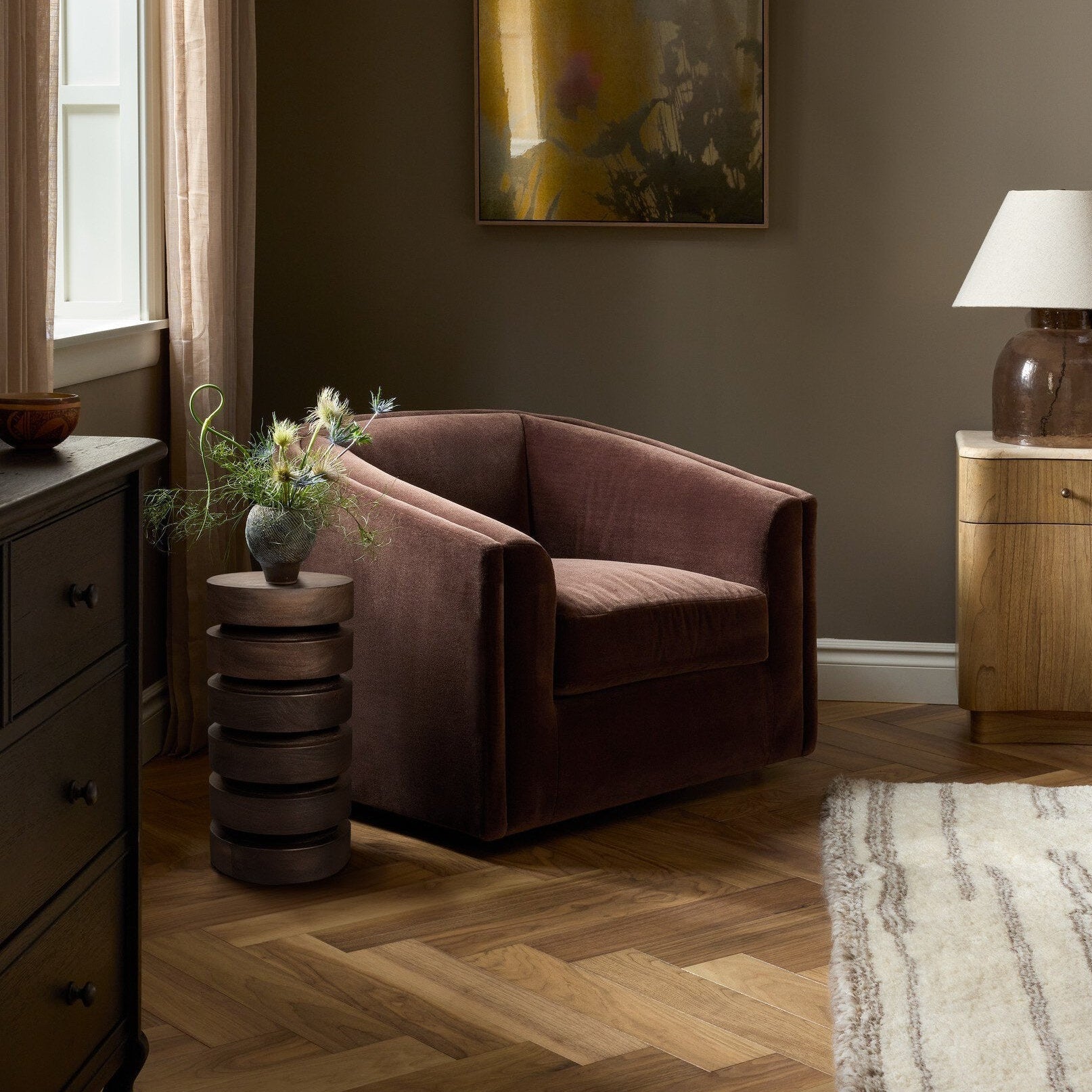Four Hands Presley Monte Chocolate Swivel Chair shown in a decorated space (2)