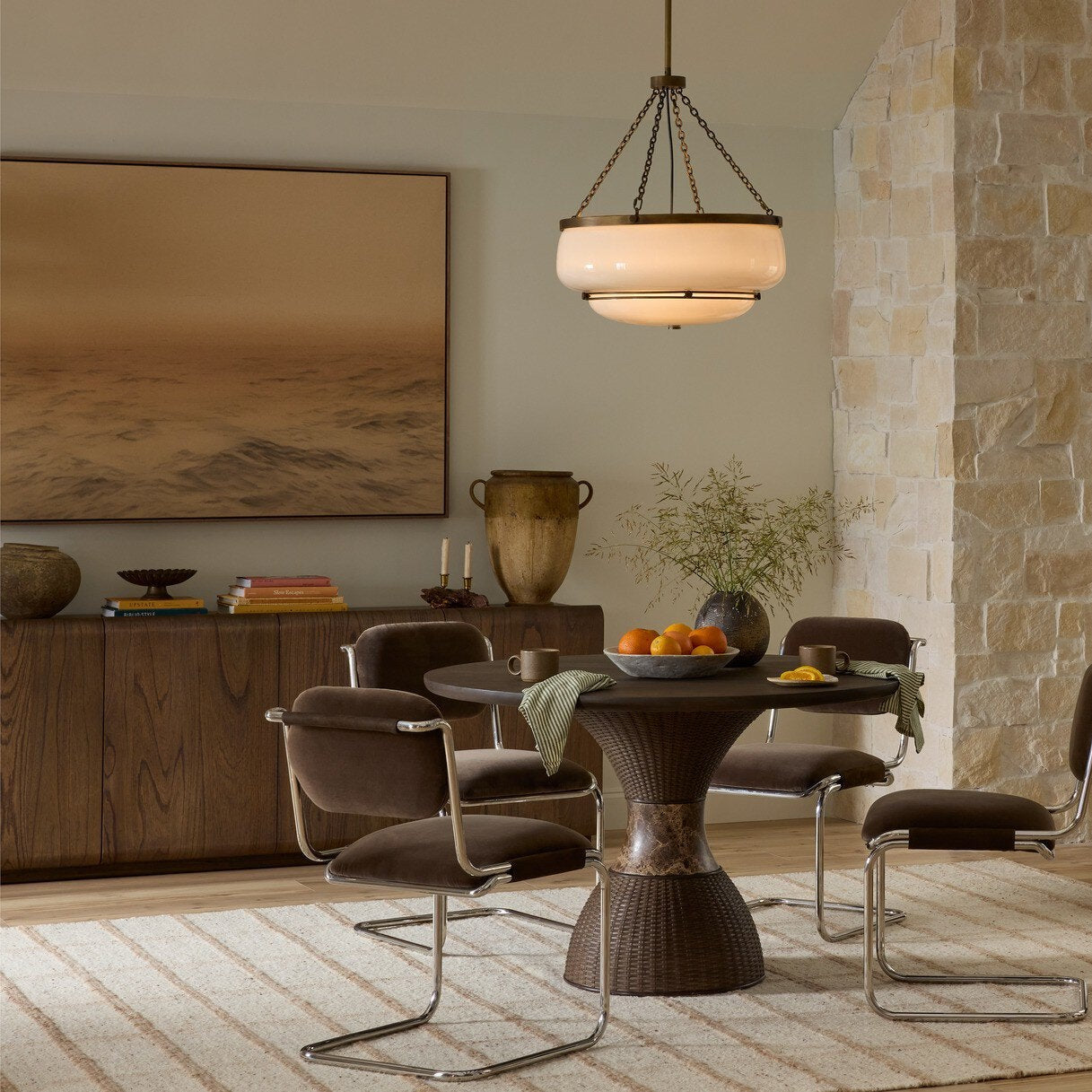 Four Hands Arlet Stained Saddle Brown Mindi Sideboard shown in a decorated space