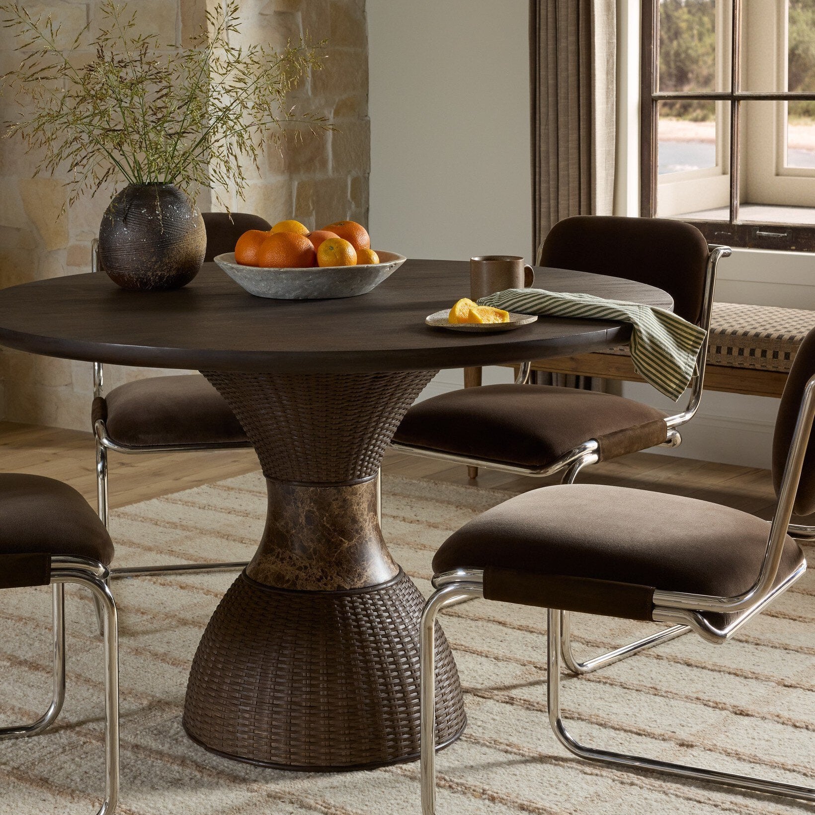 Four Hands Lono Espresso Mango Dining Table in a styled room scene