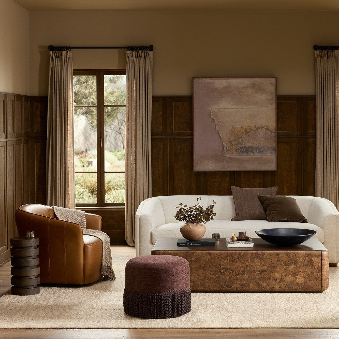 Four Hands Rodgers Sonoma Chestnut Swivel Chair in a styled room scene