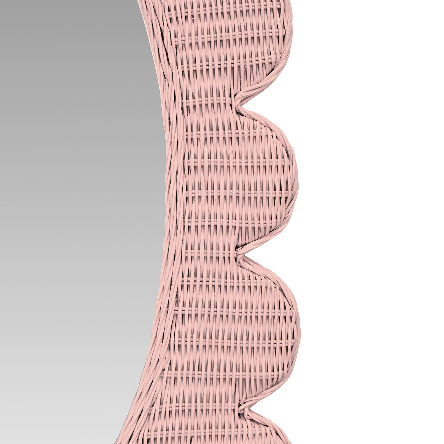 Close-up of the pink rattan finish on the Lillian Pink Wall Mirror