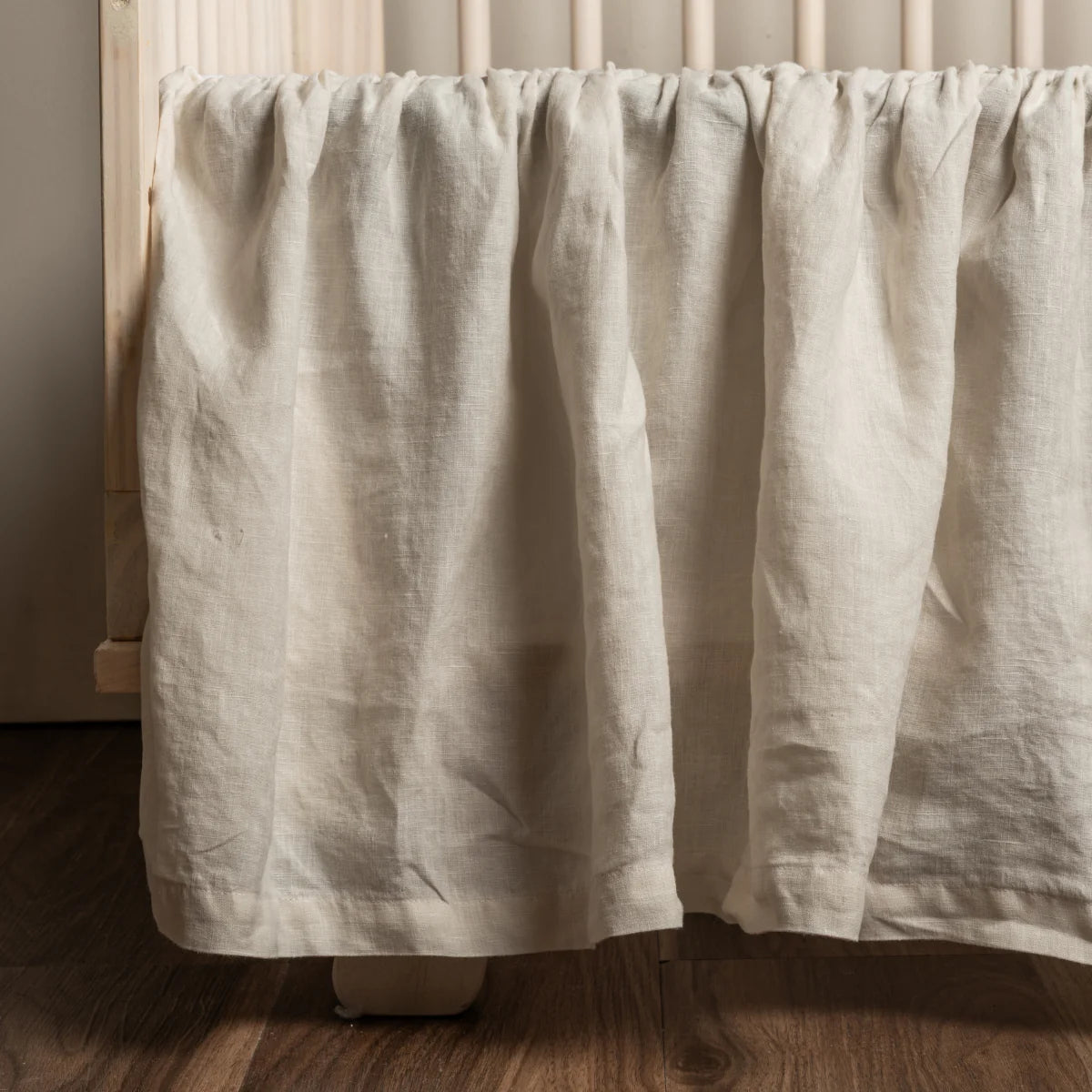 Bella Notte Linen Crib Skirt in linen, soft-focus lifestyle styling