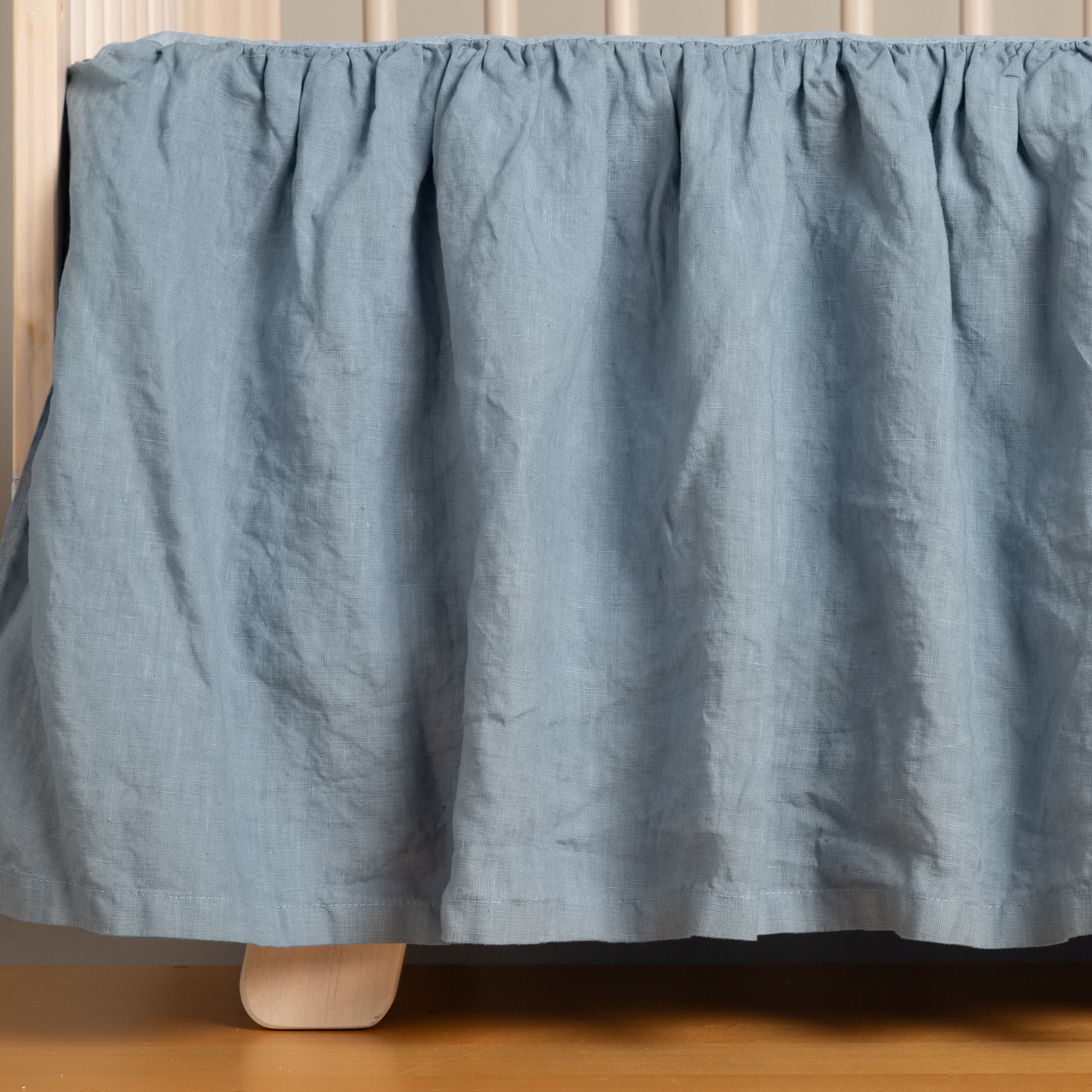 Bella Notte Linen Crib Skirt in linen, gentle drape highlighting the hand of the linen
