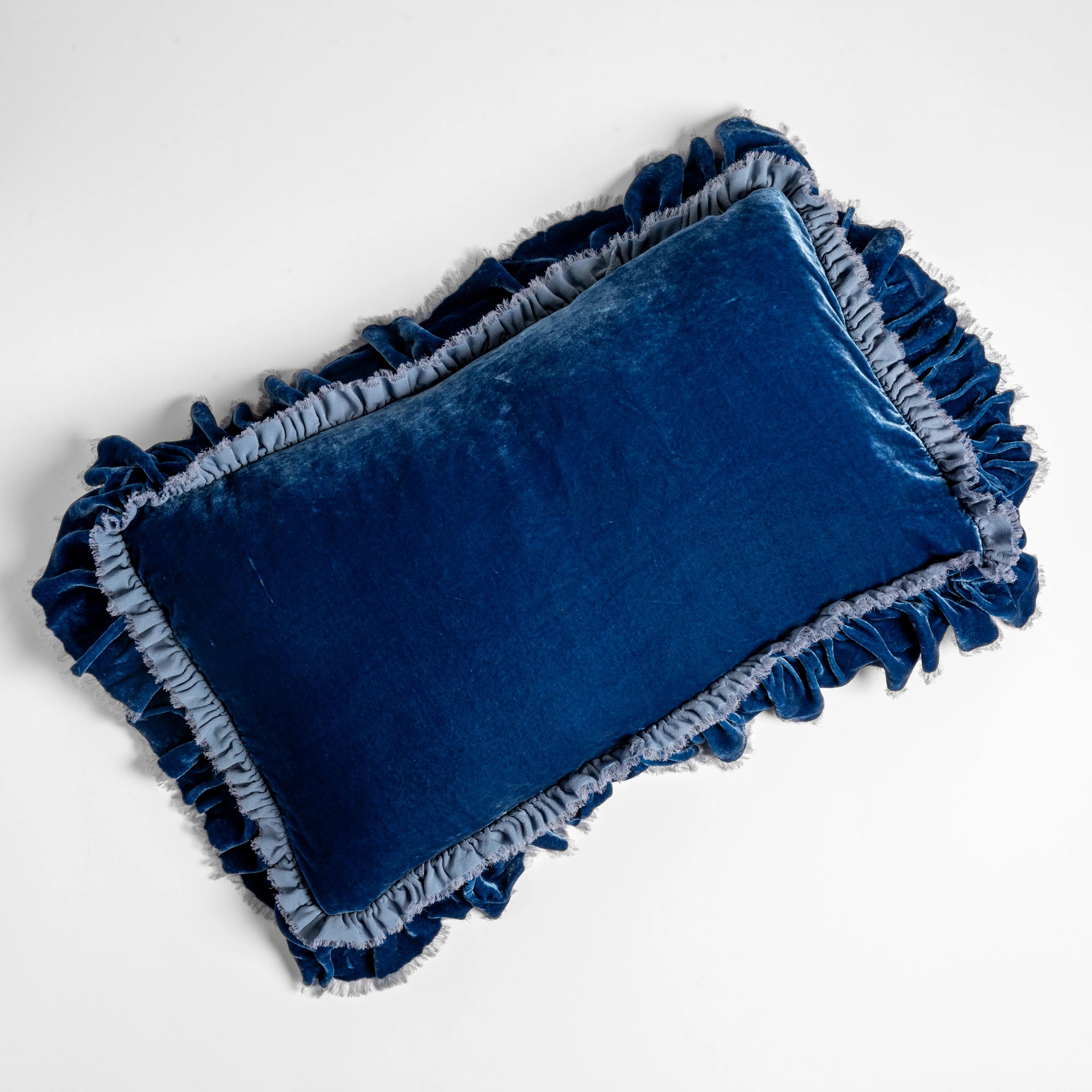 Bella Notte Loulah Accent Pillow in silk velvet, styled on a chaise for a relaxed look