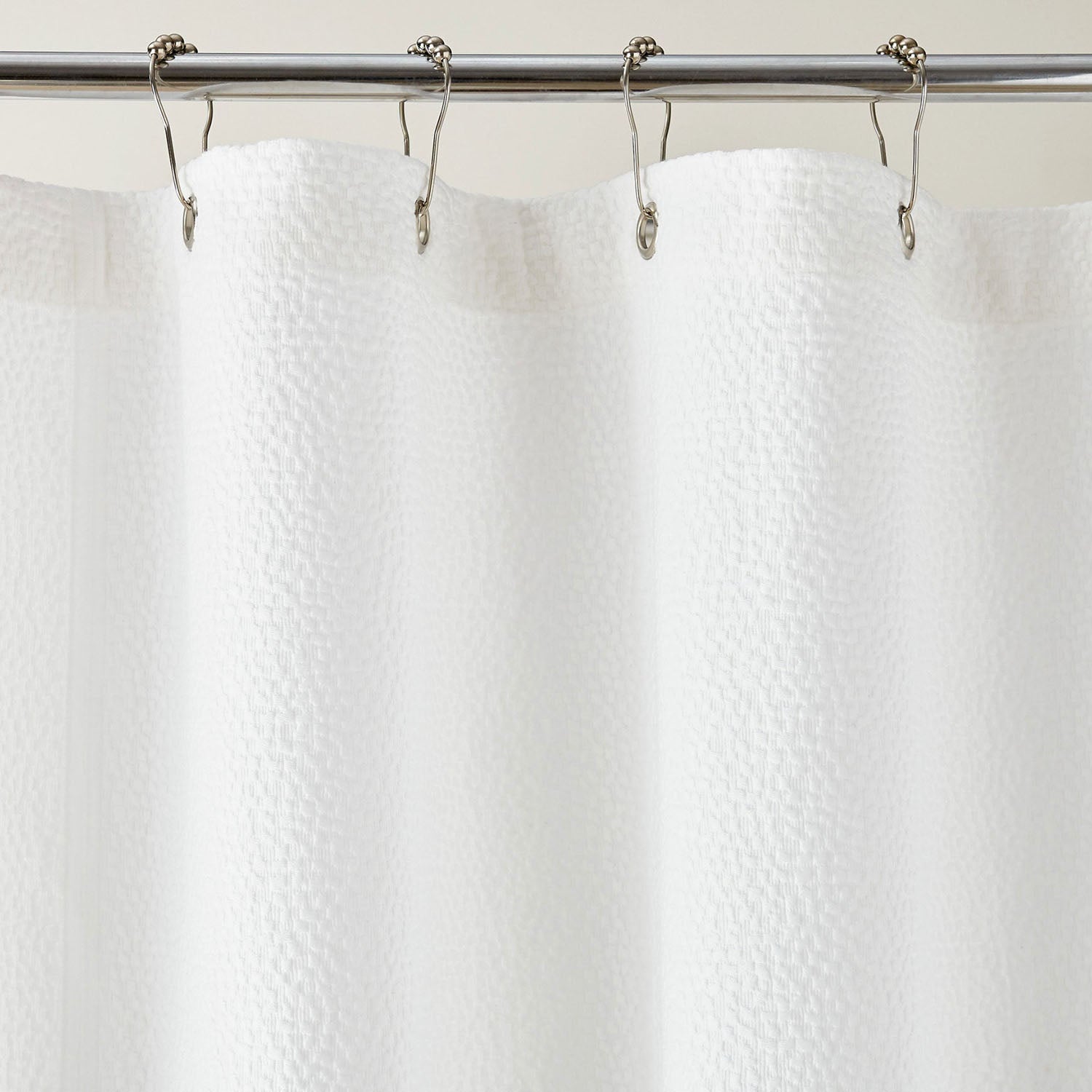 Peacock Alley Montauk matelasse cotton shower curtain detail of the silver grommets
