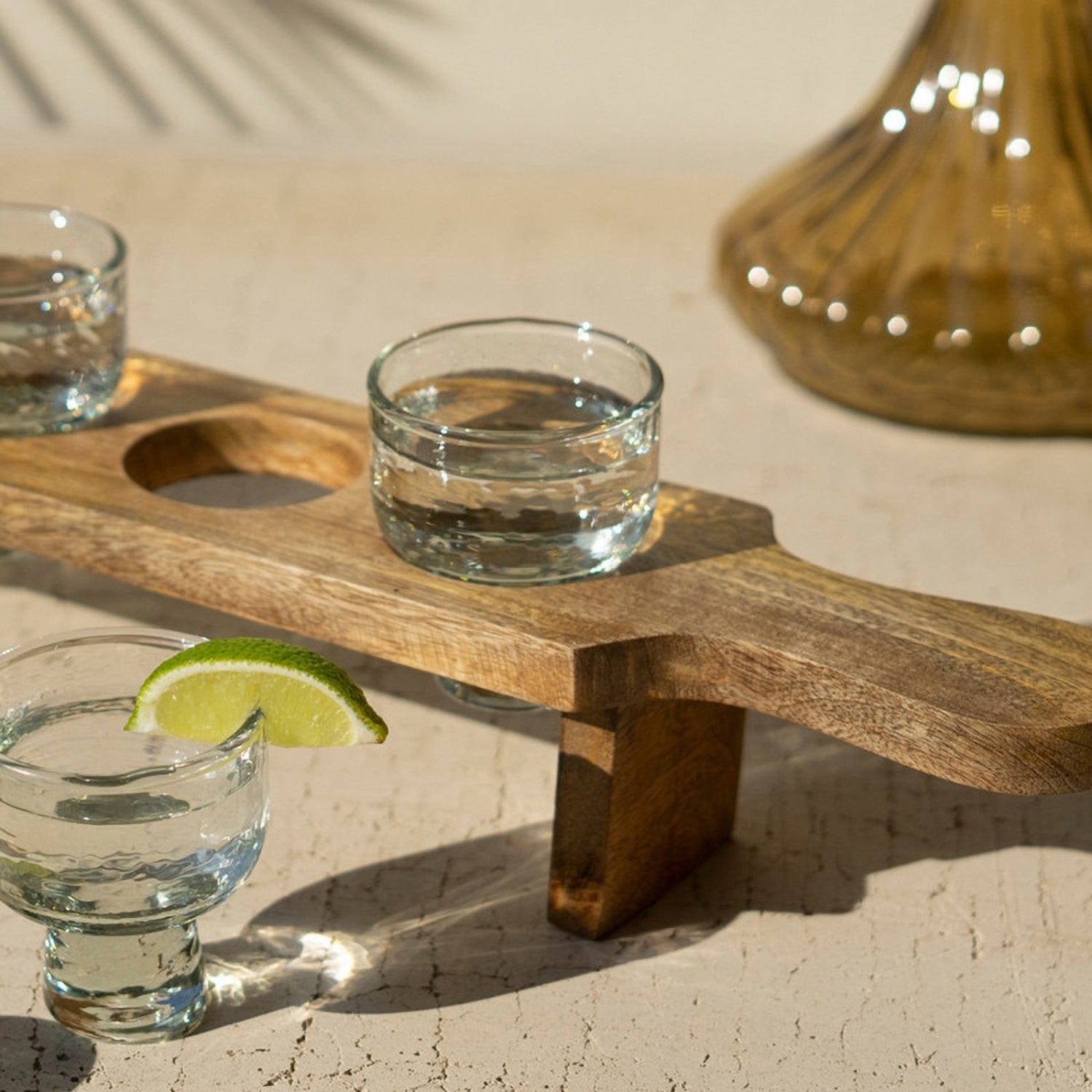Tequila Flight with Four Glasses on a Wooden Tray