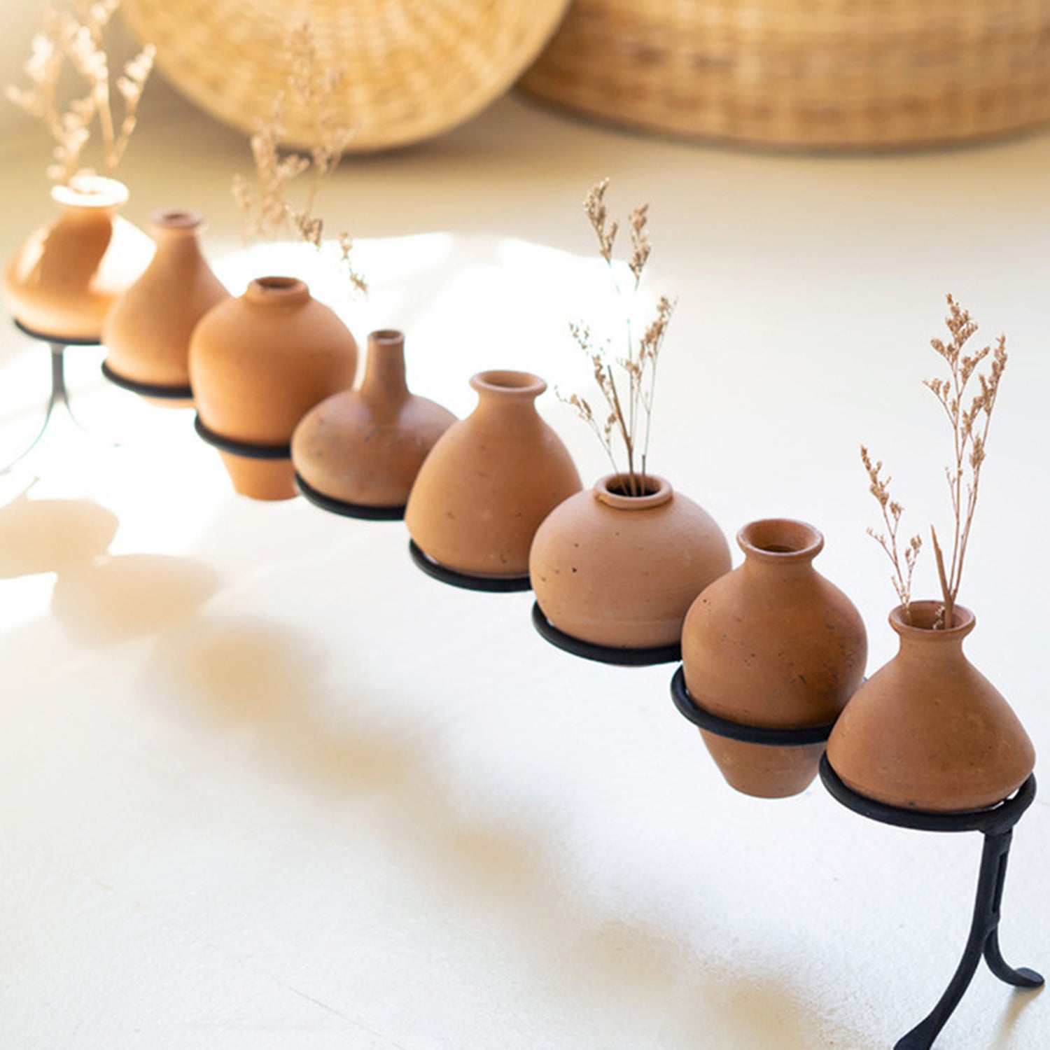 Eight Clay Vessels on an Iron Base