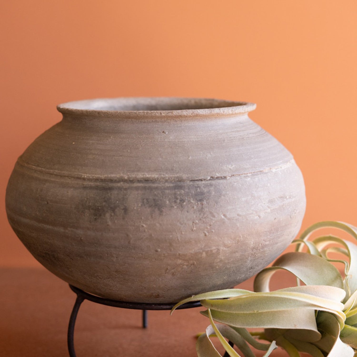 Black Clay Urn on an Iron Stand