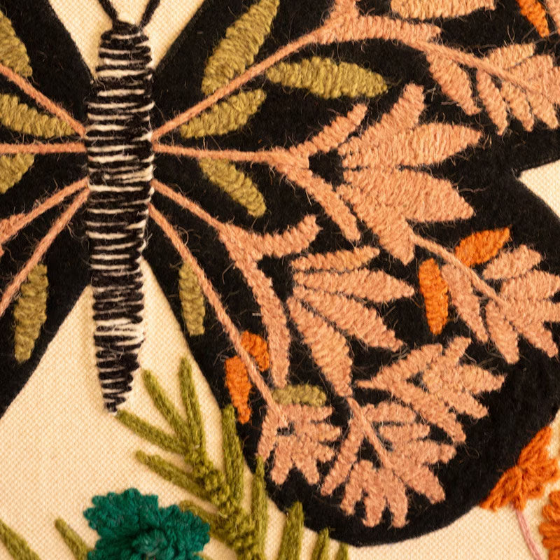 Close-up of the layered cotton and felt butterfly texture in the wood frame