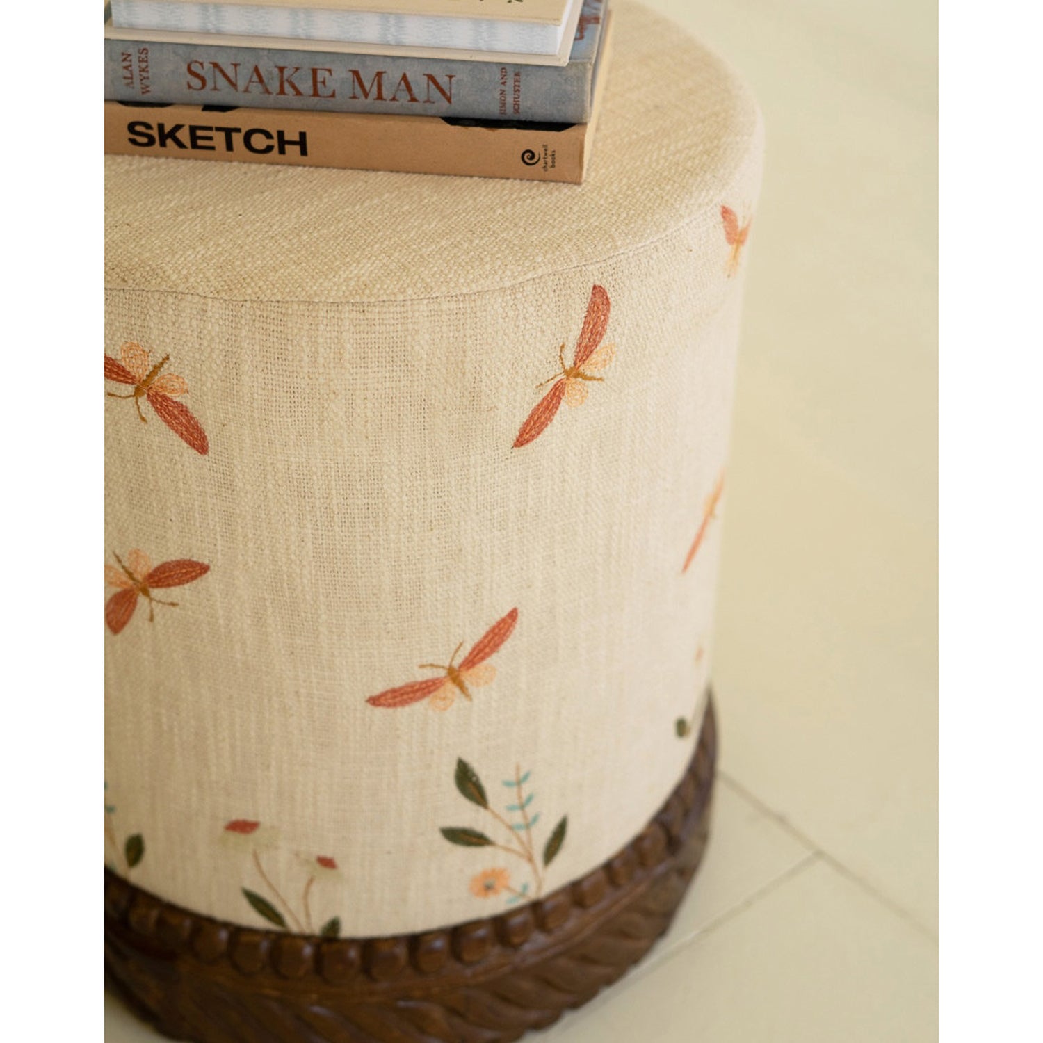 Upholstered Cream Ottoman with Embroidered Detail