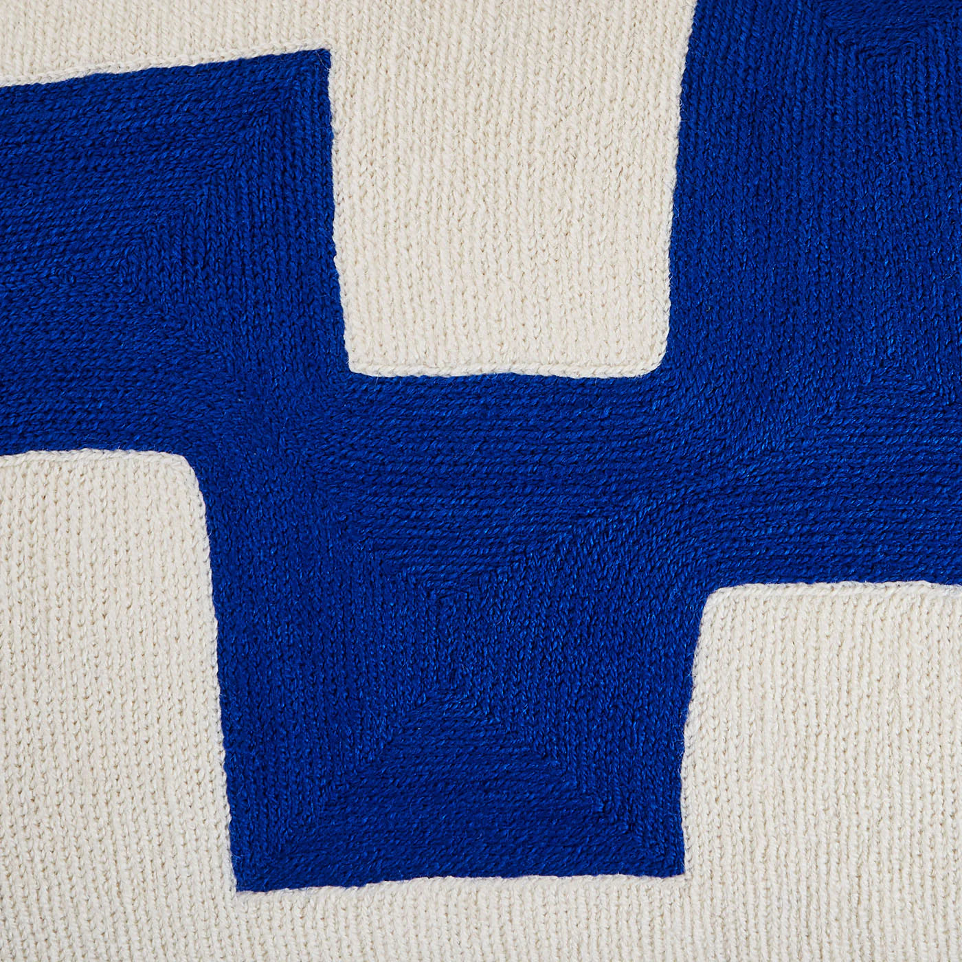Ojai Blocks wool pillow styled on a sofa