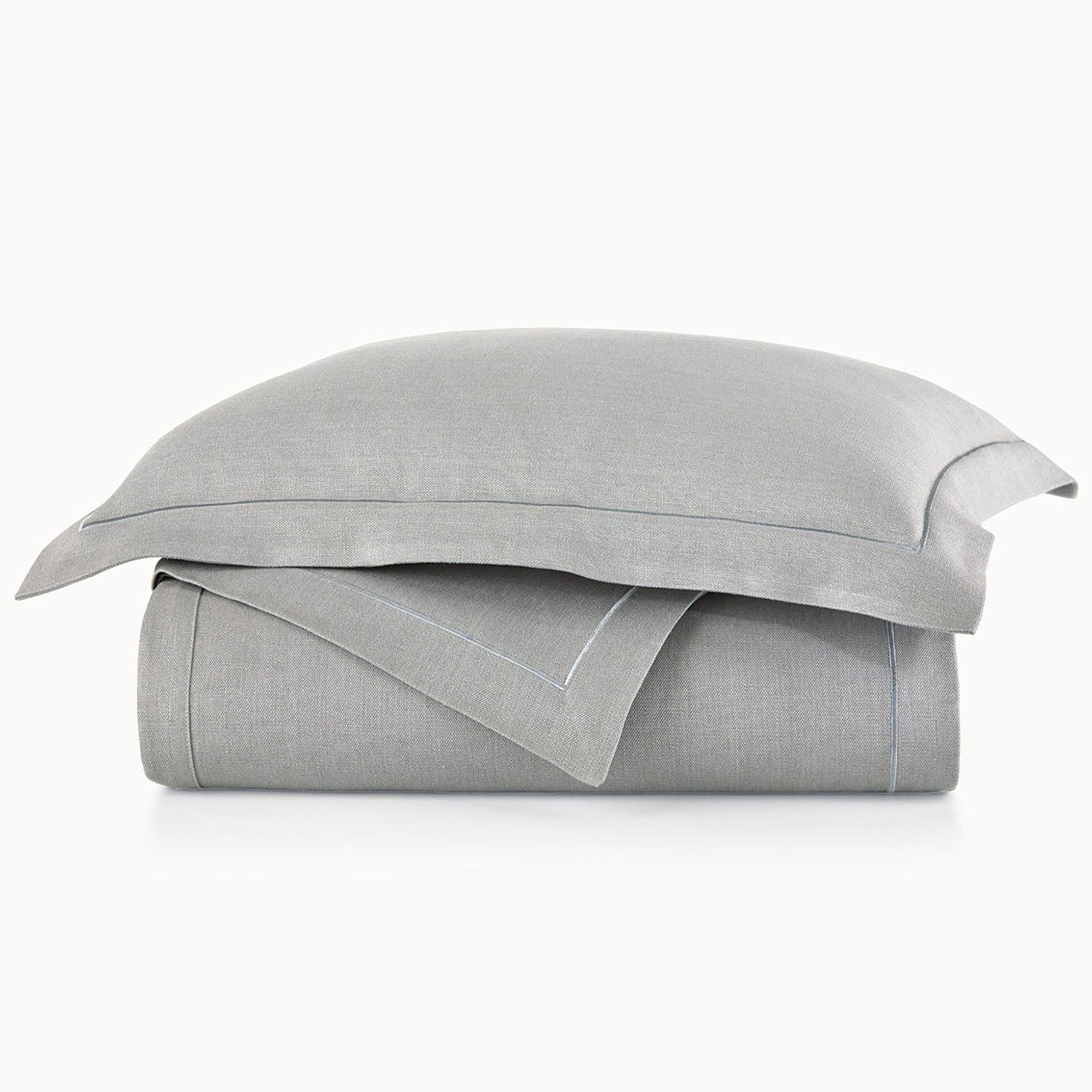 Peacock Alley Rio Satin Stitch Coverlet 100% linen satin stitch coverlet, stack of neatly folded linens