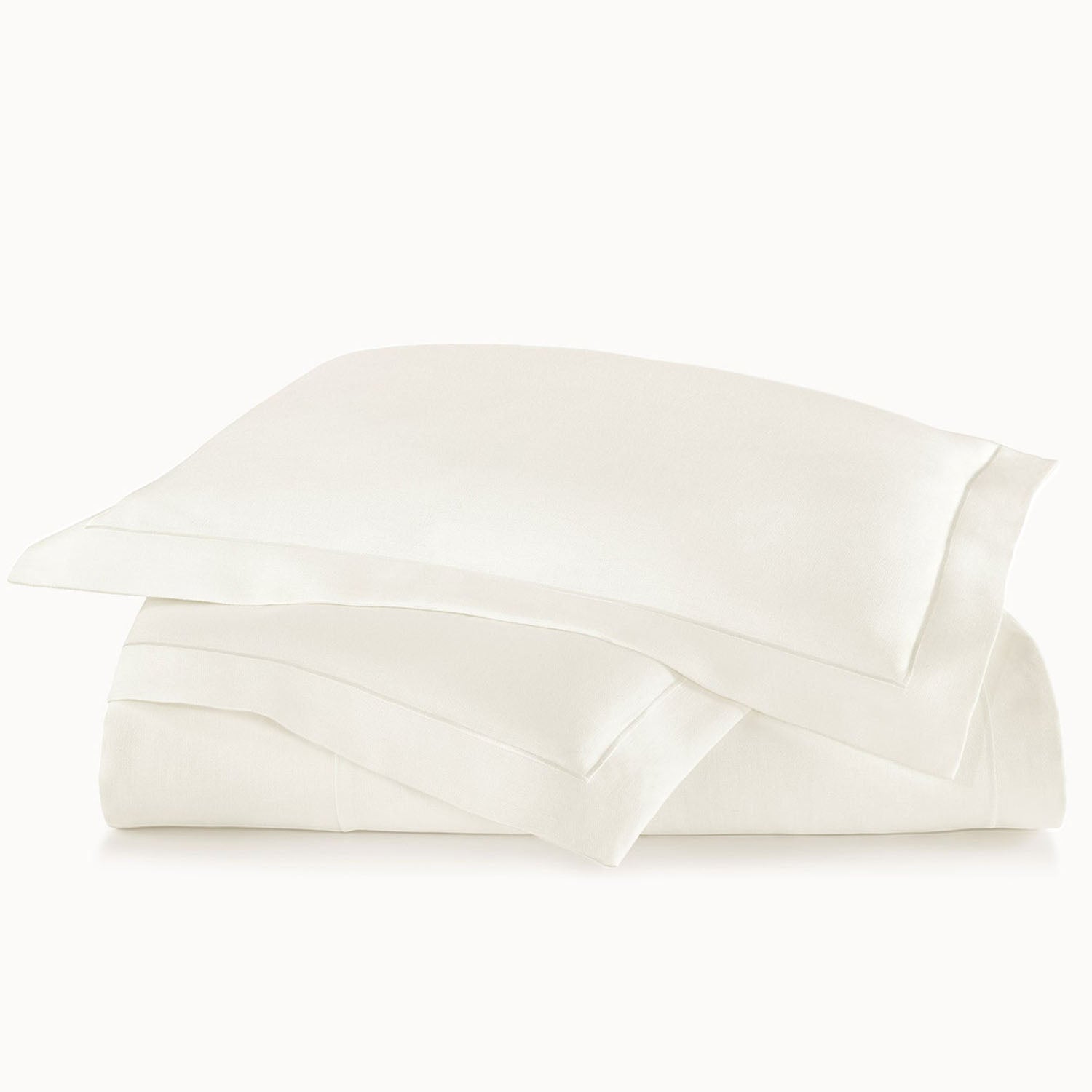 Peacock Alley Rio Flanged Linen Duvet Cover 100% linen flanged duvet cover, draped and layered detail on the bed