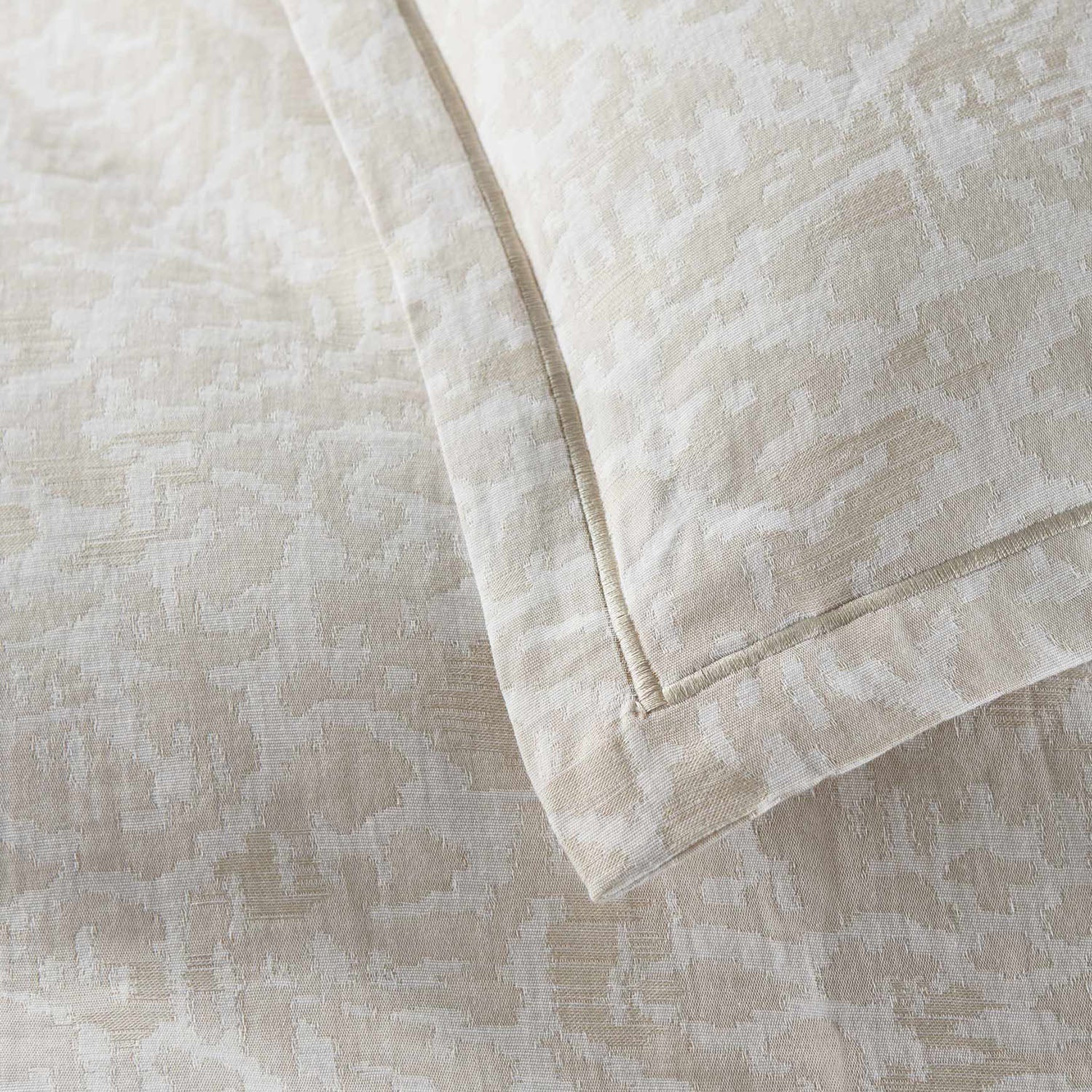 Peacock Alley Ravenna jacquard cotton duvet cover draped and layered detail