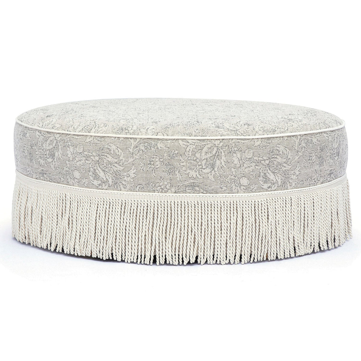 TOV Furniture Tassy Tasseled Round Ottoman in neutral floral jacquard, primary product view