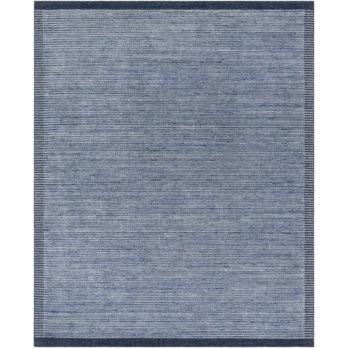 Surya Yasmin YMN-2303 Hand Knotted Rug layered over flooring