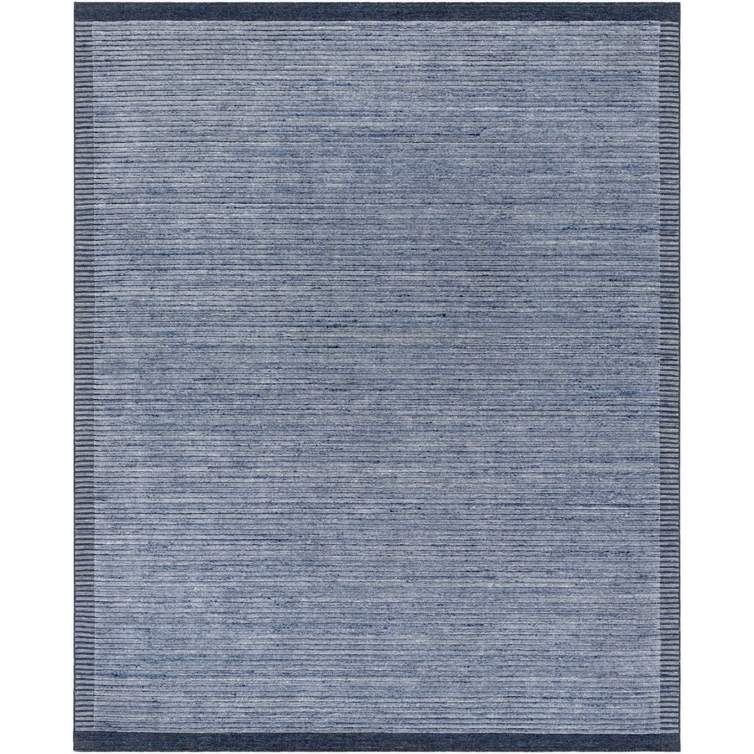 Surya Yasmin YMN-2303 Hand Knotted Rug layered over flooring